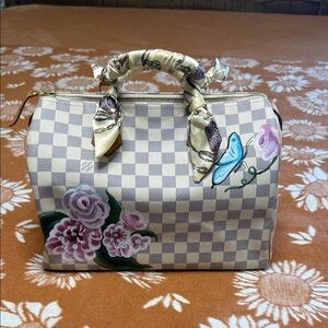 Louis Vuitton Speedy 30 Top-Handle Bag in Cream with Pink Accents.